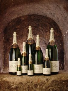 Different size bottles of Pol Roger in a cellar