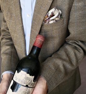 Stuart George with a bottle of Château Mouton Rothschild 1945
