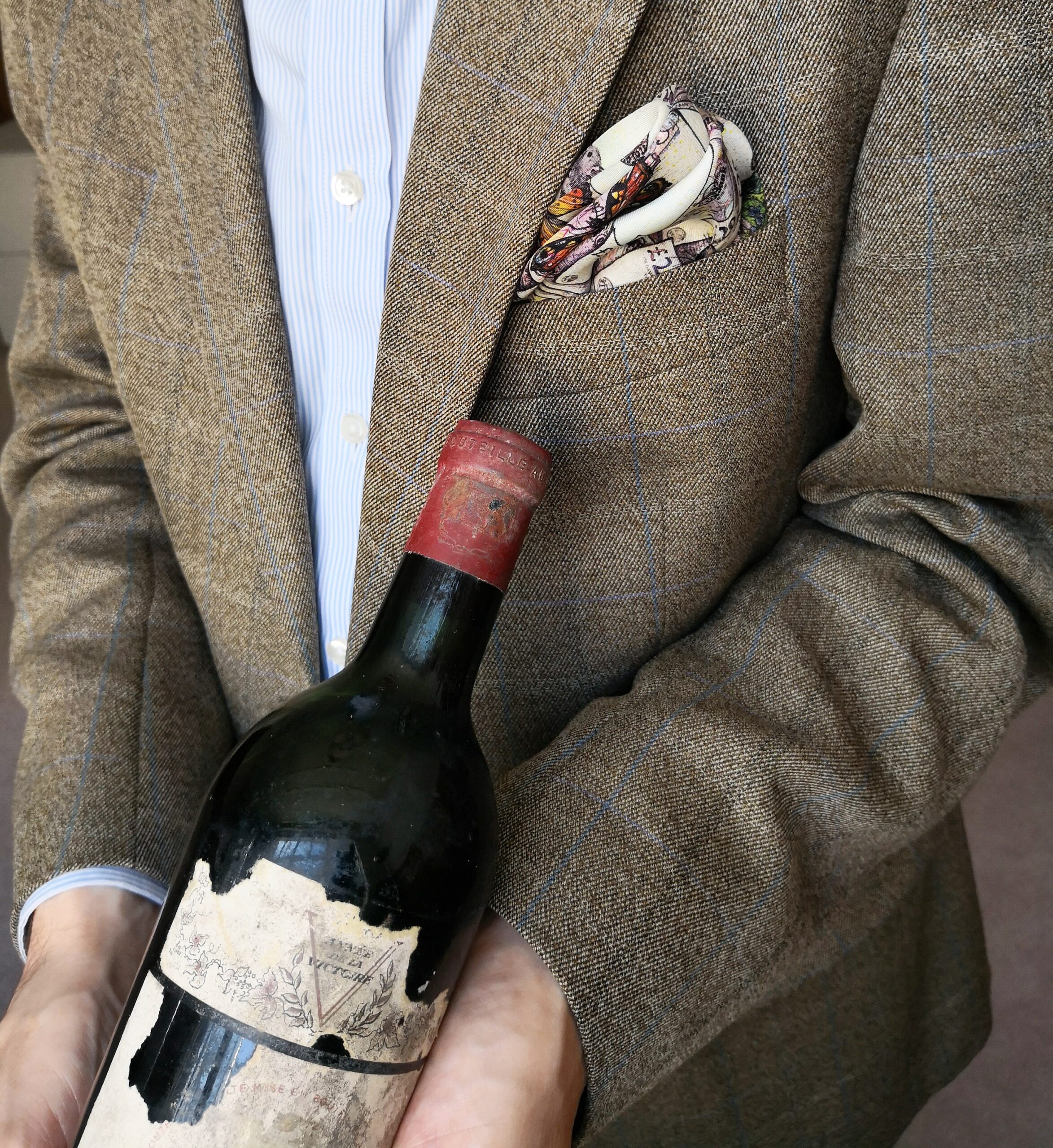 Stuart George with a bottle of Château Mouton Rothschild 1945