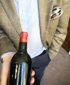 Stuart George with a bottle of Château Mouton Rothschild 1945