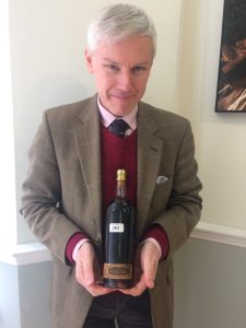 Stuart George and a bottle of Château d'Yquem 1945 from the Savoy Hotel