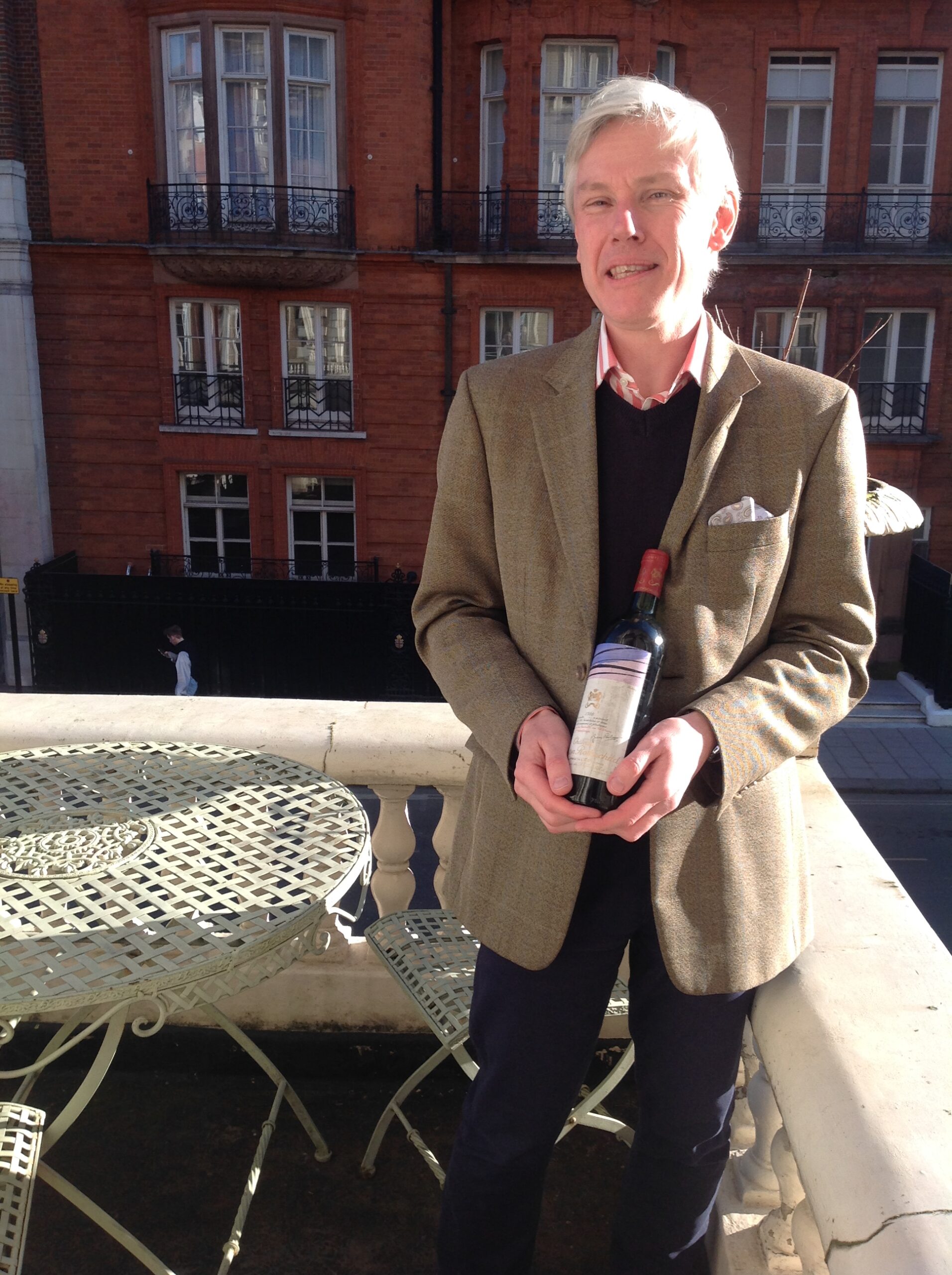 Stuart George with a bottle of Chateau Mouton Rothschild 1980